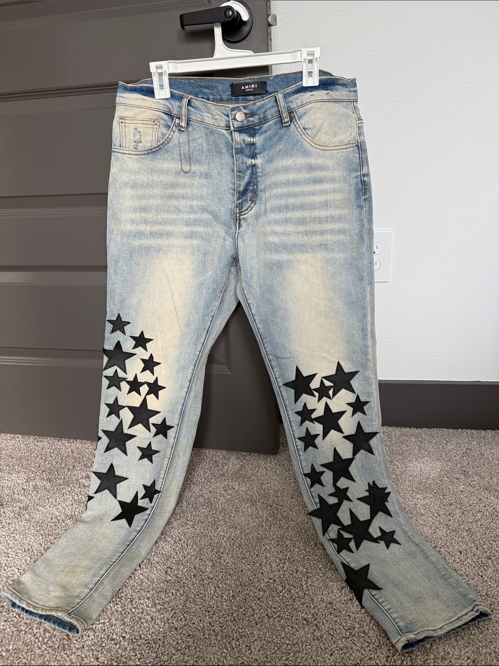 AMIRI Light Blue Straight Jeans with Black Star Appliqués